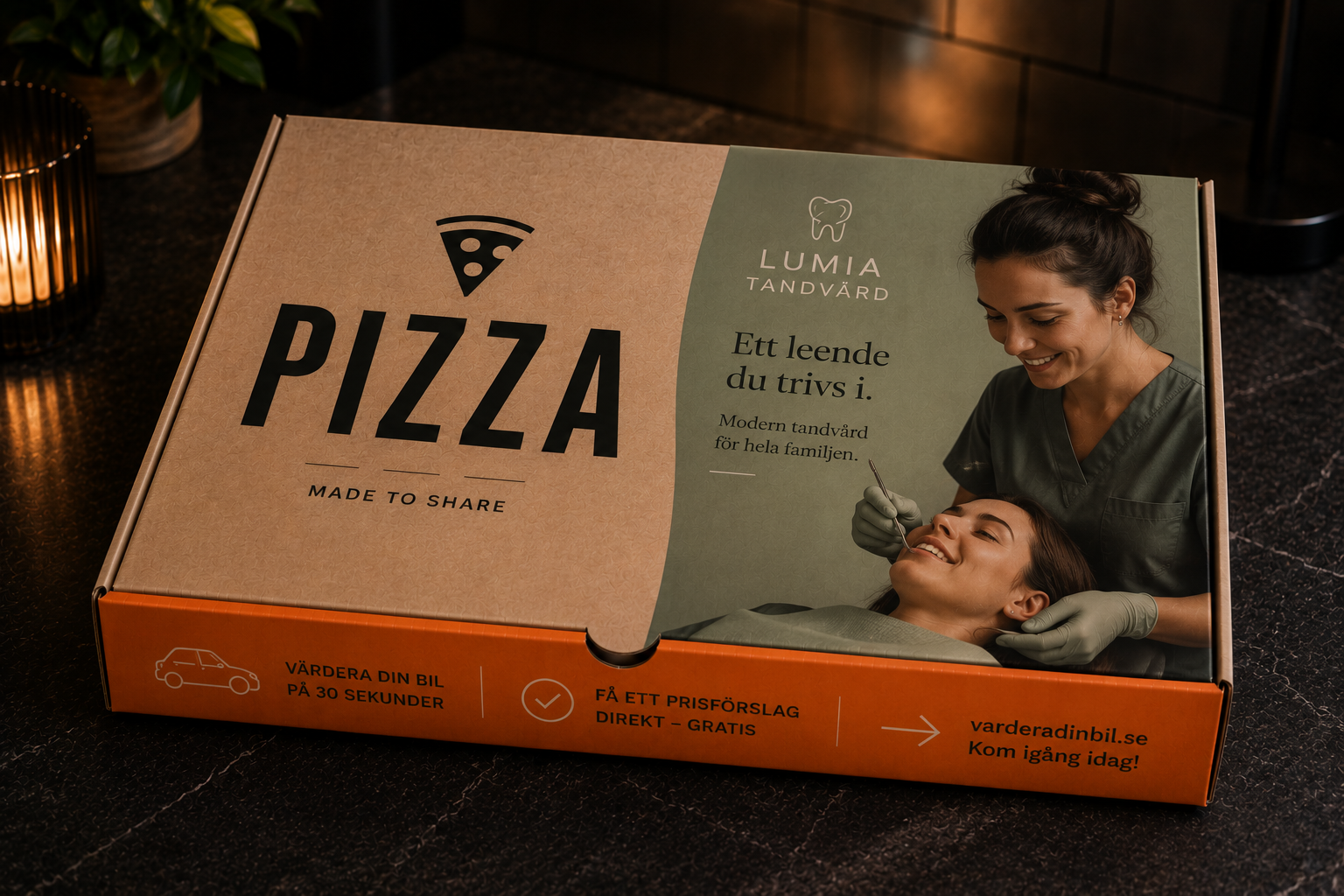 Pizzakartong med flera annonser — Lumia Tandvård på locket och bilvärdering på sidan